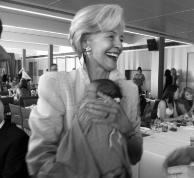 Dame Quentin Bryce gives Martine Harte's son a cuddle on www.engagingwomen.com.au