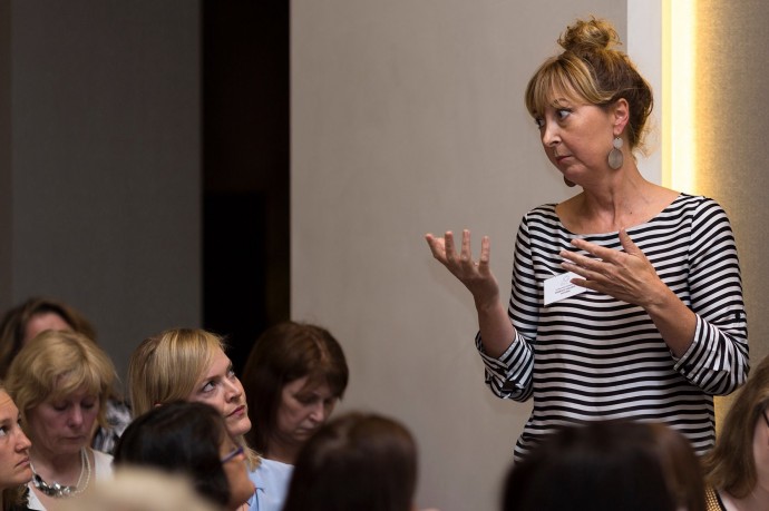 Martine Harte listens to Domestic Violence Victoria CEO Fiona McCormack at the #DVFORUM